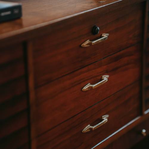 an image of a large glossy wooden chest of drawers